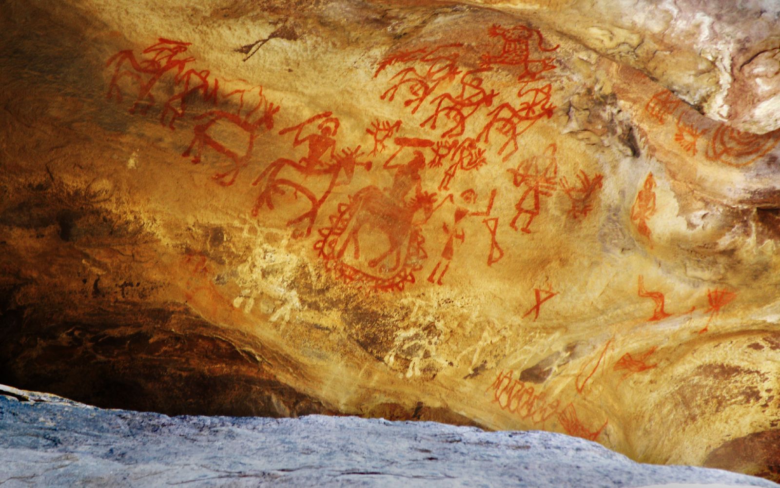 Bhimbetka People riding horses holding weapons