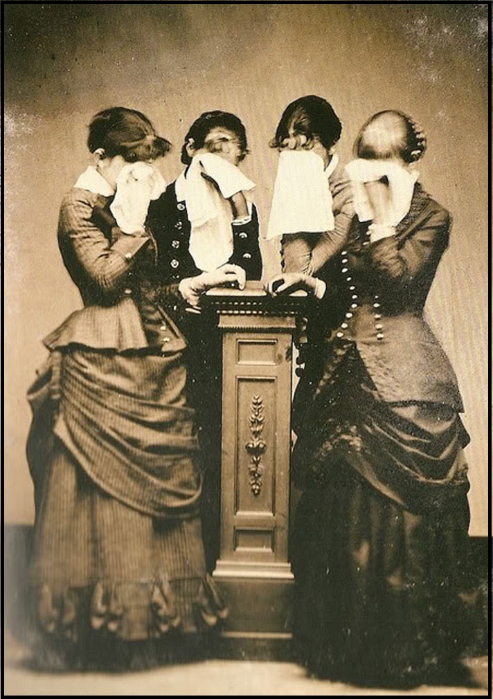 Ladies mourning together for a loss.