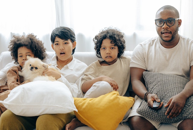 Family watching movie together on Christmas 